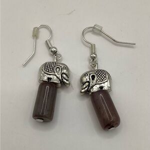 Silver toned Elephant standing on Purple Columns beaded dangle earrings